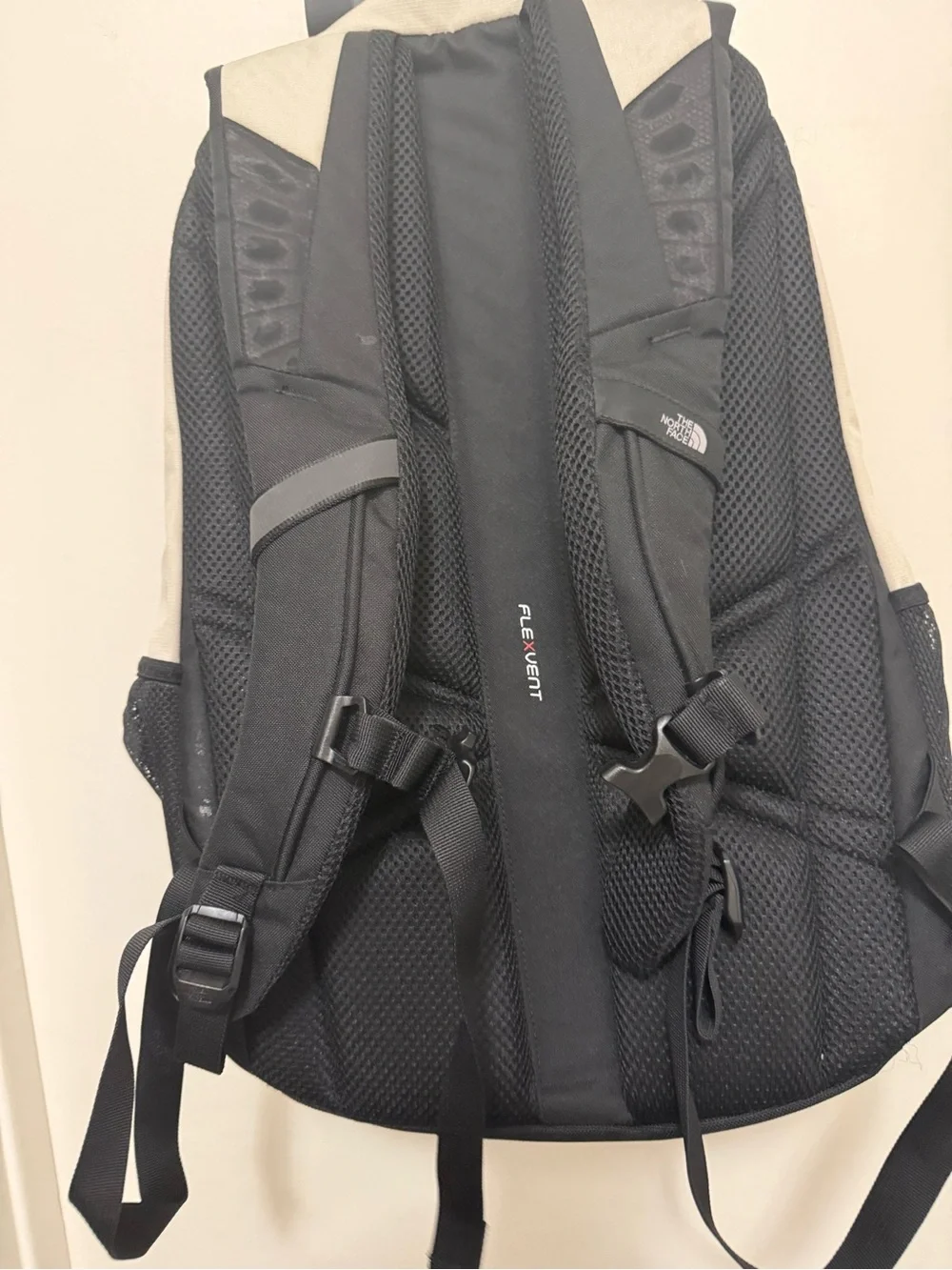 The North Face Two-Tone Beige and Black Backpack with Bungee Front